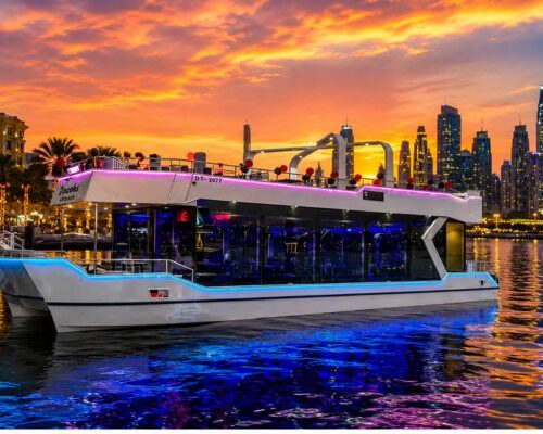 White Yacht luxury Canal cruise Dubai at sunset